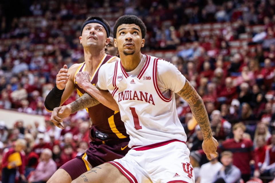 Jan 12, 2024; Bloomington, Indiana, USA; Indiana Hoosiers center Kel'el Ware (1) boxes out Minnesota Golden Gophers forward Dawson Garcia (3) in the second half at Simon Skjodt Assembly Hall.