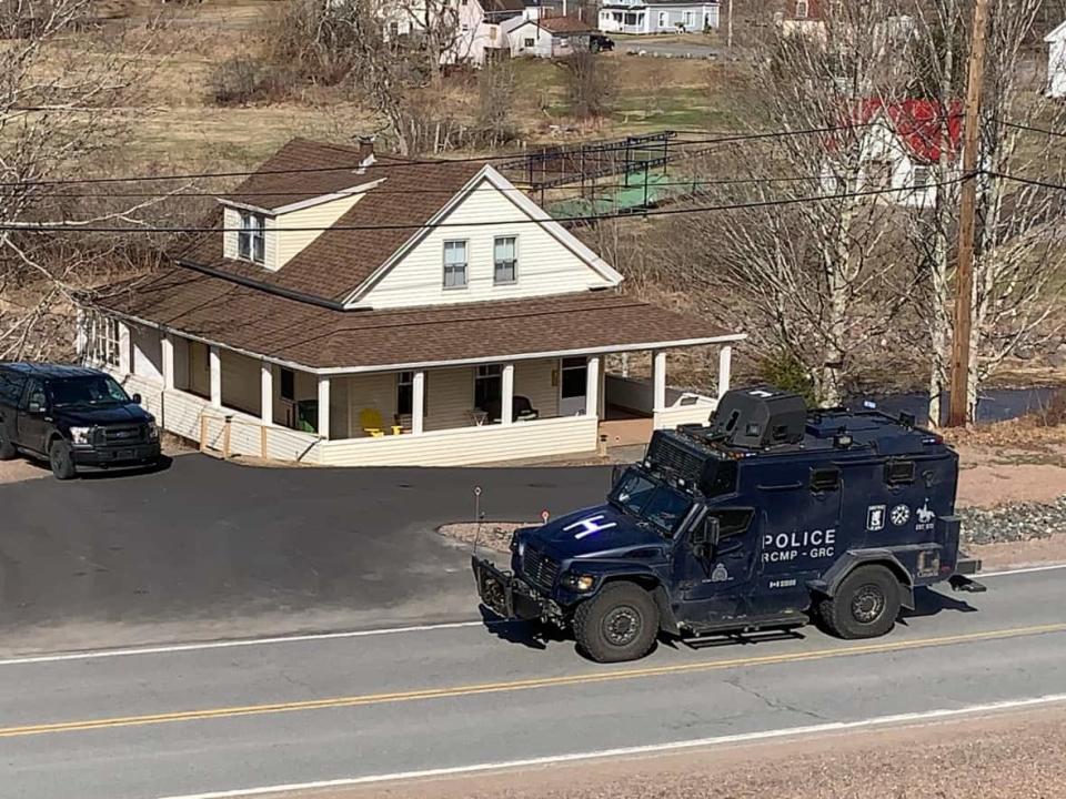 The RCMP's tactical armoured vehicle is seen travelling on Sunday, April 19, 2020, through the community of Great Village, N.S., about 10 minutes away from Portapique. Around 9:40 a.m., police raced to try to locate an active shooter after receiving 911 calls about a woman killed in Wentworth, N.S.  (Shaina Luck/CBC - image credit)