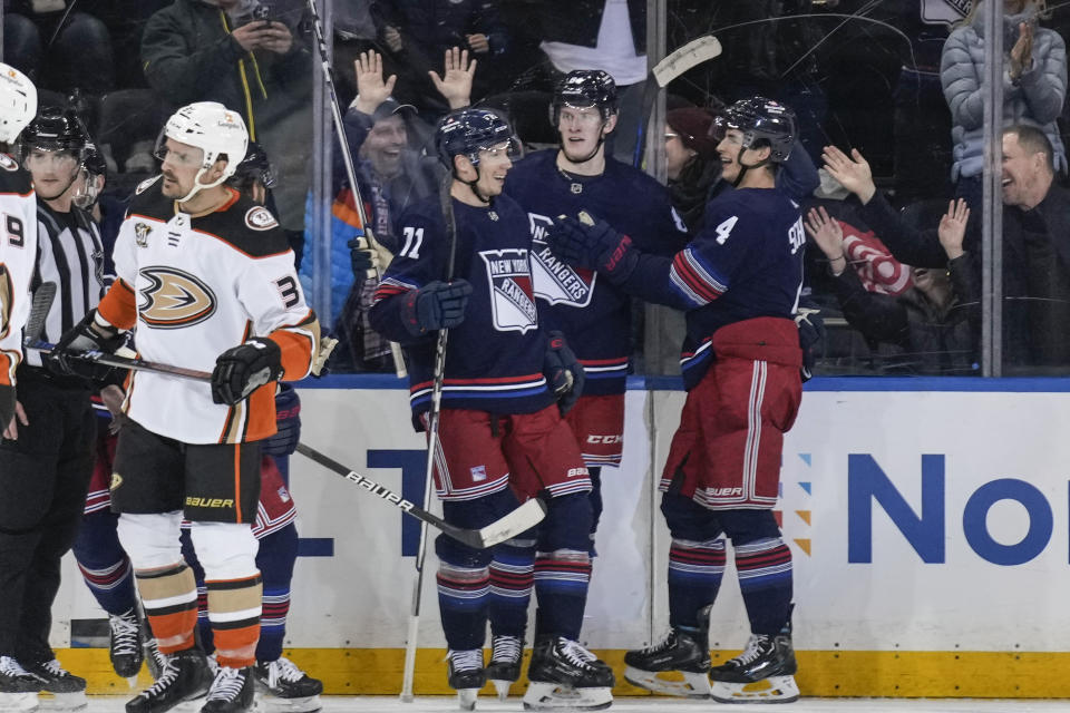 New York Rangers' Adam Edstrom, second from right, celebrates his goal against the Anaheim Ducks during the third period of an NHL hockey game Friday, Dec. 15, 2023, in New York. (AP Photo/Seth Wenig)