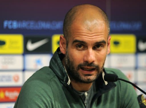 FC Barcelona's coach Pep Guardiola at a press conference at Camp Nou stadium in Barcelona on April 20. He has rallied to the support of Lionel Messi after the Argentinian star's penalty miss that almost certainly cost his team a place in the Champions League final