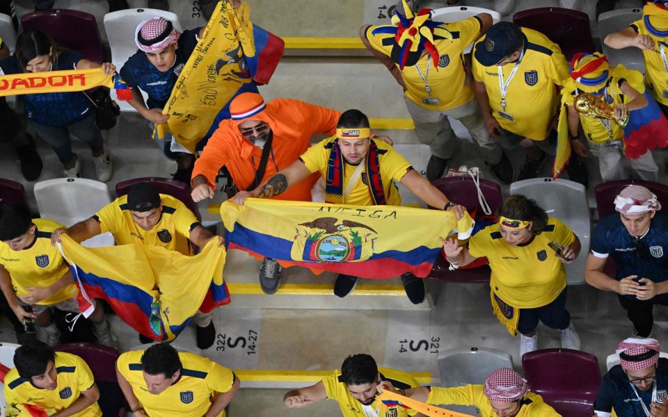Netherlands and Ecuador supporters cheer ahead of the Qatar 2022 World Cup Group A - ANTONIN THUILLIER/AFP via Getty Images