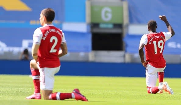 Taking the knee is not enough, we need to further support black players that are victims of racism  (POOL/AFP via Getty Images)