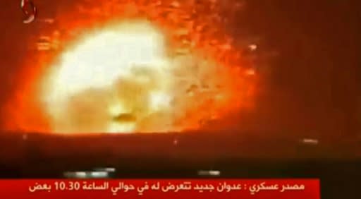 An image grab taken from the Syrian TV channel, Al-Ekhbariya Al-Souriya, on April 30, 2018 allegedly shows missile strikes targeting central Syria the previous night but without giving precise information about the exact location Missile strikes on central Syria killed 26 pro-regime fighters, most of them Iranians, a monitor said Monday, in a raid that bore the hallmarks of Tehran's archfoe Israel. According to the Syrian Observatory for Human Rights monitoring group, missile strikes hit two military targets in Aleppo and Hama provinces late on april 29