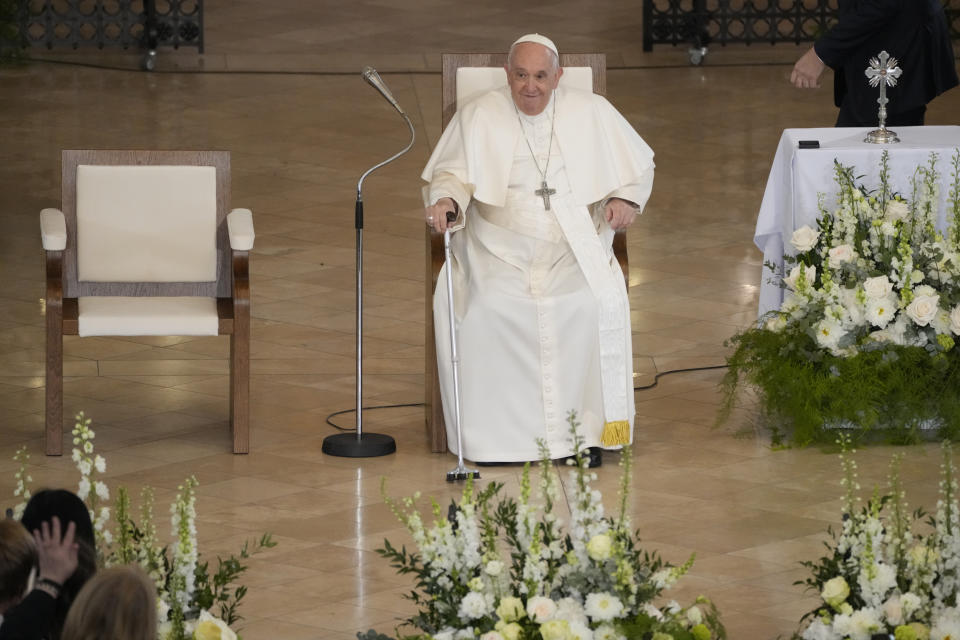 Pope Francis smiles as he arrives for a meeting with poor people and refugees in St. Elizabeth of Hungary Church in Budapest, Hungary, Saturday, April 29, 2023. The Pontiff is in Hungary for a three-day pastoral visit. (AP Photo/Andrew Medichini)