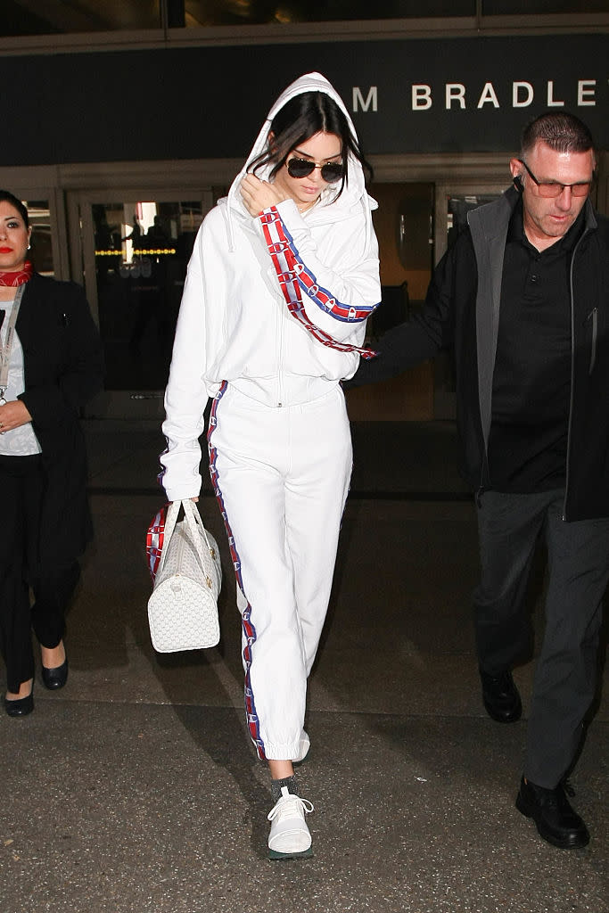 Kendall Jenner in a white sweatsuit — that costs more than rent. (Photo: Getty Images)