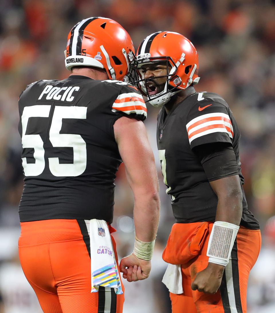 Browns quarterback Jacoby Brissett celebrates with center Ethan Pocic (55) after a second-half TD by Amari Cooper against the Bengals, Monday, Oct. 31, 2022, in Cleveland.
