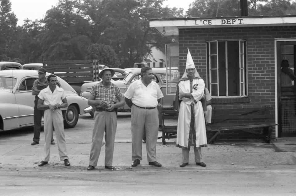 <div class="inline-image__caption"><p>Ku Klux Klan, Reidsville, Georgia, 1957 – A Klan member, the Chief of Police and the Sheriff wait for the decorated KKK cars on their way to a ceremony to pass by. </p></div> <div class="inline-image__credit">All photographs are copyright Fred Baldwin from the book Dear Mr. Picasso: An Illustrated Love Affair with Freedom published by Schilt Publishing</div>