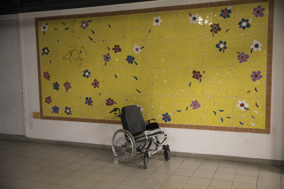 This photo taken on Dec.9, 2019 shows an empty wheelchair at the entrance to La Timone hospital in Marseille, southern France. In a hospital in Marseille, student doctors are holding an exceptional, open-ended strike to demand a better future. France’s vaunted public hospital system is increasingly stretched to its limits after years of cost cuts, and the interns at La Timone - one of the country’s biggest hospitals - say their internships are failing to prepare them as medical professionals. Instead, the doctors-in-training are being used to fill the gaps. (AP Photo/Daniel Cole)