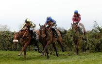 Horse Racing - Crabbie's Grand National Festival - Aintree Racecourse - 9/4/16 Rule The World ridden by David Mullins (R) jumps the last fence on his way to win the 5.15 Crabbie's Grand National Chase Action Images via Reuters / Jason Cairnduff Livepic EDITORIAL USE ONLY.