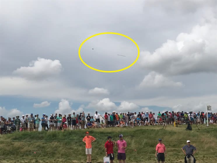 A plane pulling a banner calling for the USGA to move the 2017 U.S. Women's Open flew over Erin Hills Saturday. (Yahoo Sports)