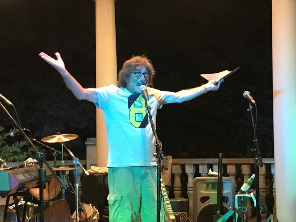 Donnie Iris says, "What I do?" as he receives a proclamation Friday from Beaver's mayor for Donnie Iris Day.