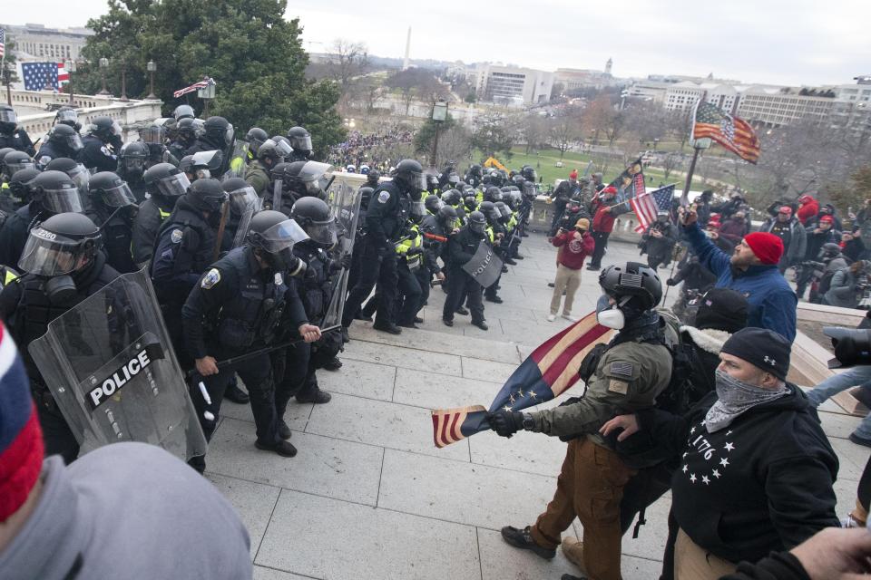 FILE - U.S. Capitol Police push back rioters who were trying to enter the U.S. Capitol on on Jan. 6, 2021, in Washington. New internal documents provided by former Facebook employee-turned-whistleblower Frances Haugen provide a rare glimpse into how the company, after years under the microscope for the policing of its platform, appears to have simply stumbled into the Jan. 6 riot (AP Photo/Jose Luis Magana, File)