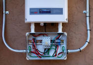 A DC to AC solar converter is shown during the installation of a residential solar power system in Scripts Ranch, San Diego, California, U.S. October 14, 2016. Picture taken October 14, 2016. REUTERS/Mike Blake