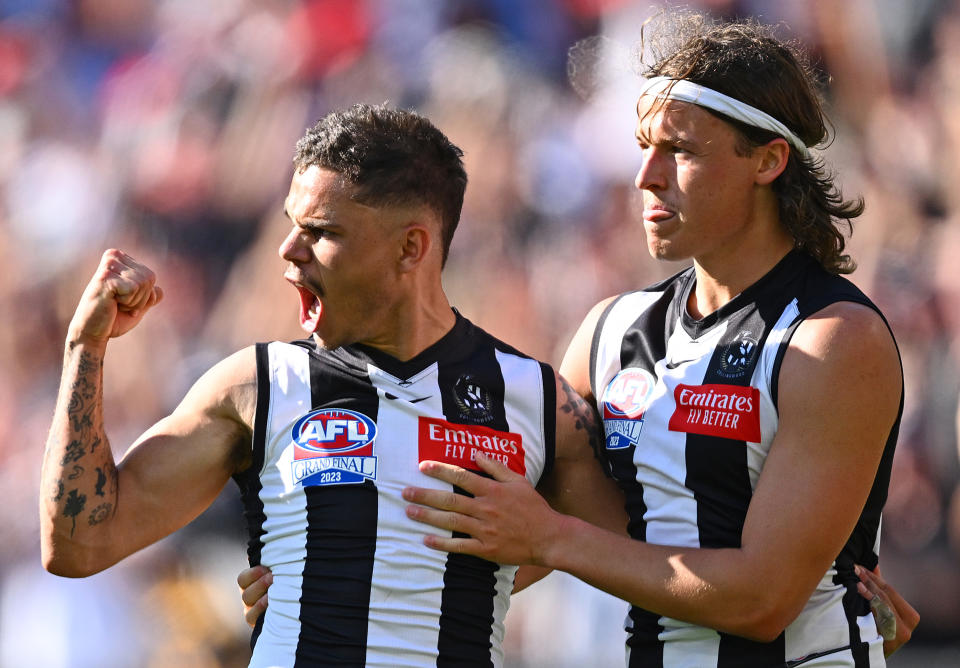 MELBOURNE, AUSTRALIA - SEPTEMBER 30: Bobby Hill of the Magpies is congratulated by Jack Ginnivan after kicking a goal during the 2023 AFL Grand Final match between Collingwood Magpies and Brisbane Lions at Melbourne Cricket Ground, on September 30, 2023, in Melbourne, Australia. (Photo by Quinn Rooney/Getty Images)