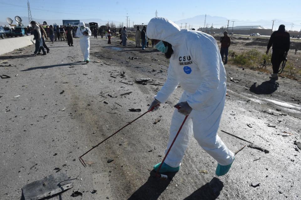 Security officials inspect the site of the suicide bomb attack in Quetta (AFP via Getty Images)