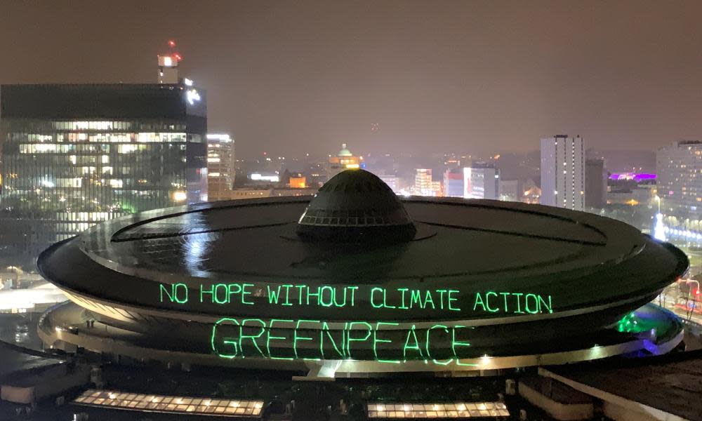 Greenpeace activists project words “No hope without climate action” on the roof of the venue of the COP24 conference in Katowice, Poland