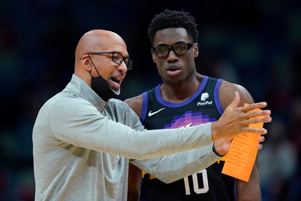 Phoenix Suns head coach Monty Williams talks with forward Jalen Smith (10) in the first half of an NBA basketball game against the New Orleans Pelicans in New Orleans, Tuesday, Jan. 4, 2022.