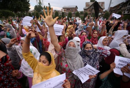 Kashmiri women shout slogans at a protest in Srinagar
