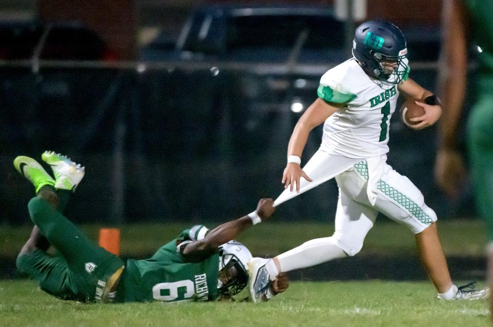 Richwoods’ Leo Barfield (66) tries to stop Peoria Notre Dame’s Ben Mullens from running in to the endzone in the first half of their Week 4 high school football game Friday, Sept. 20, 2024 at Richwoods Stadium. Mullens scored on the play and the Irish defeated the Knights 65-14.