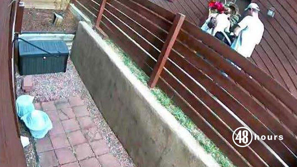 On November 22, 2018 at 1:23 p.m., a neighbor's surveillance camera captures Kelsey Berreth, Patrick Frazee and their daughter Kaylee entering Berreth's home. Berreth is carrying a poinsettia plant she had just purchased at Safeway. This image was captured shortly before her murder. / Credit: Teller County DA's Office