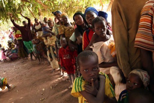 Image provided by Sanofi shows people lining up to undergo tests for the disease called Human African trypanosomiasis, a tropical disease that eats into the brain. It is commonly known as sleeping sickness