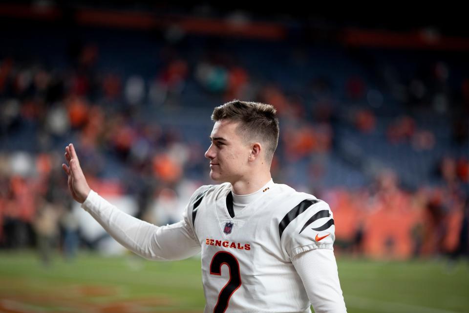 Cincinnati Bengals kicker Evan McPherson (2) waves to fans after the NFL football game on Sunday, Dec. 19, 2021, at Empower Field in Denver. The Bengals defeated the Broncos 15-10.