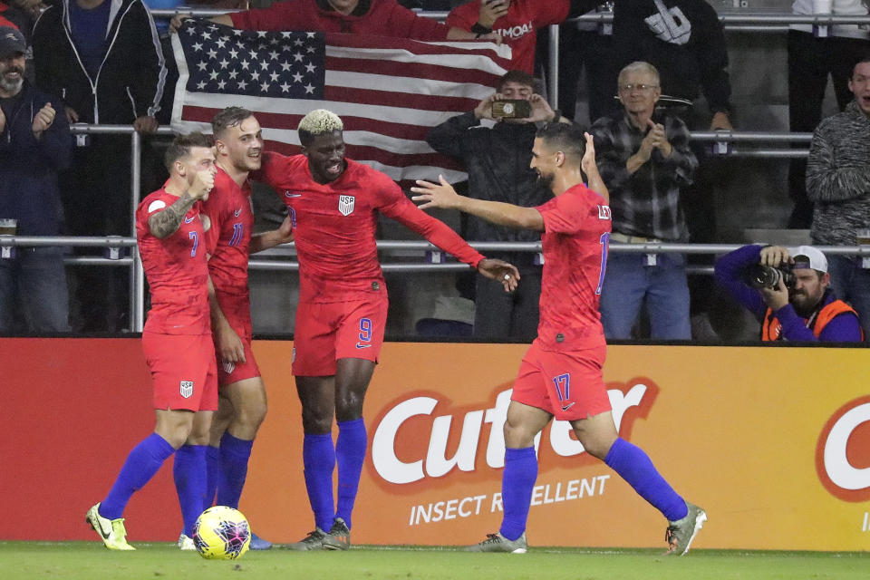 U.S. players celebrate after forward Gyasi Zardes (9) scored a goal against Canada during the first half of a CONCACAF Nations League soccer match Friday, Nov. 15, 2019, in Orlando, Fla. (AP Photo/John Raoux)