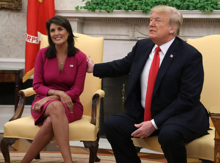 U.S. President Donald Trump announces that he has accepted the resignation of Nikki Haley as US Ambassador to the United Nations, in the Oval Office on October 9, 2018. The two of them sit side by side in yellow chairs in business clothing