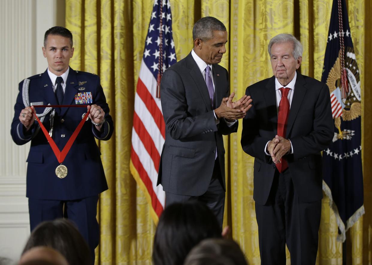 President Barack Obama prepares to award the 2014 National Humanities Medal to Larry McMurtry during a ceremony at the White House on Sept. 10, 2015. 