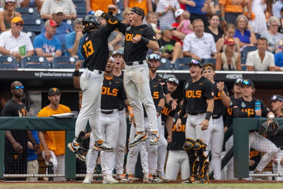 Tennessee infielder Dylan Dreiling (8) greets Reese Chapman (13) after a solo home run in the fifth inning to give the Volunteers a 4-0 lead over North Carolina during the College World Series on Sunday, June 16, 2024 at Charles Swab Field in Omaha, Nebraska.