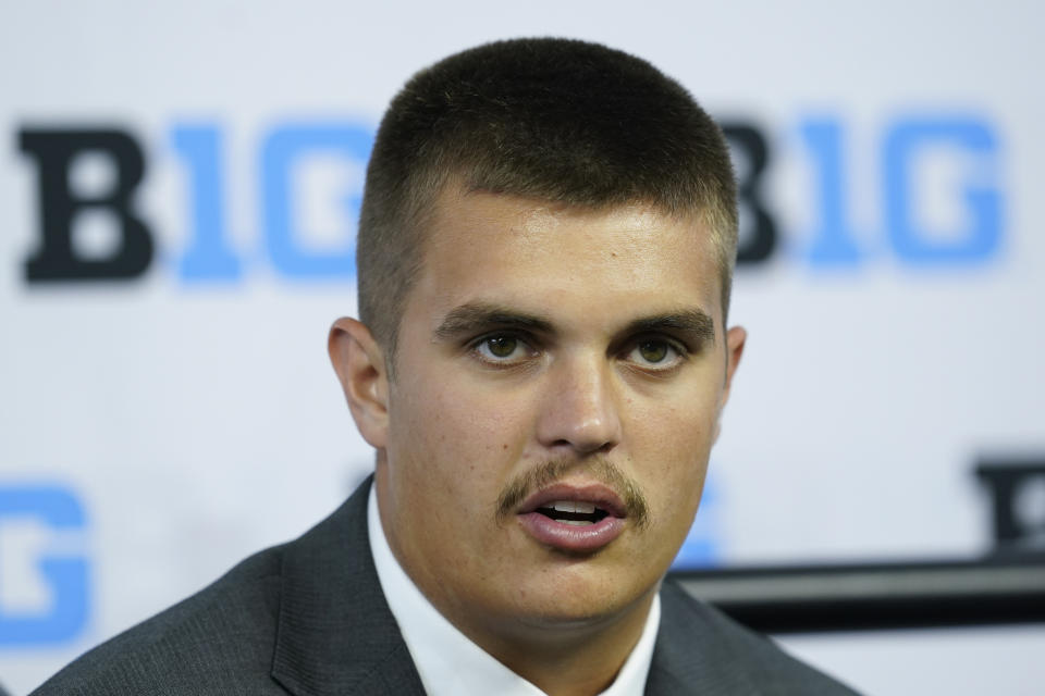 FILE - Purdue quarterback Aidan O'Connell talks to reporters during an NCAA college football news conference at the Big Ten Conference media days, at Lucas Oil Stadium, Wednesday, July 27, 2022, in Indianapolis. Purdue quarterback Aidan O'Connell started his college career as a walk-on. A year ago, he earned second-team all-conference honors. And on Thursday night, in a battle of two sixth-year quarterbacks, O'Connell will try to cement his place as the newest member of the Boilermakers "Cradle of Quarterbacks."(AP Photo/Darron Cummings, File)