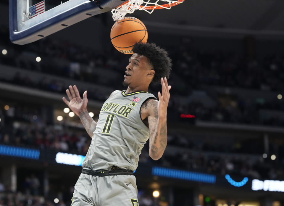Baylor forward Jalen Bridges dunks in the first half of a first-round college basketball game against UC Santa Barbara in the men's NCAA Tournament Friday, March 17, 2023, in Denver. (AP Photo/David Zalubowski)