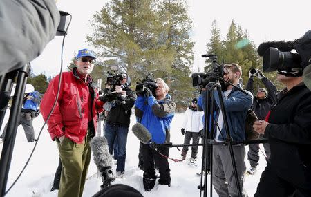 Frank Gehrke, (in red jacket) talks about the above-average results of the first snow survey of winter conducted by the California Department of Water Resources in Phillips, California December 30, 2015. REUTERS/Fred Greaves,