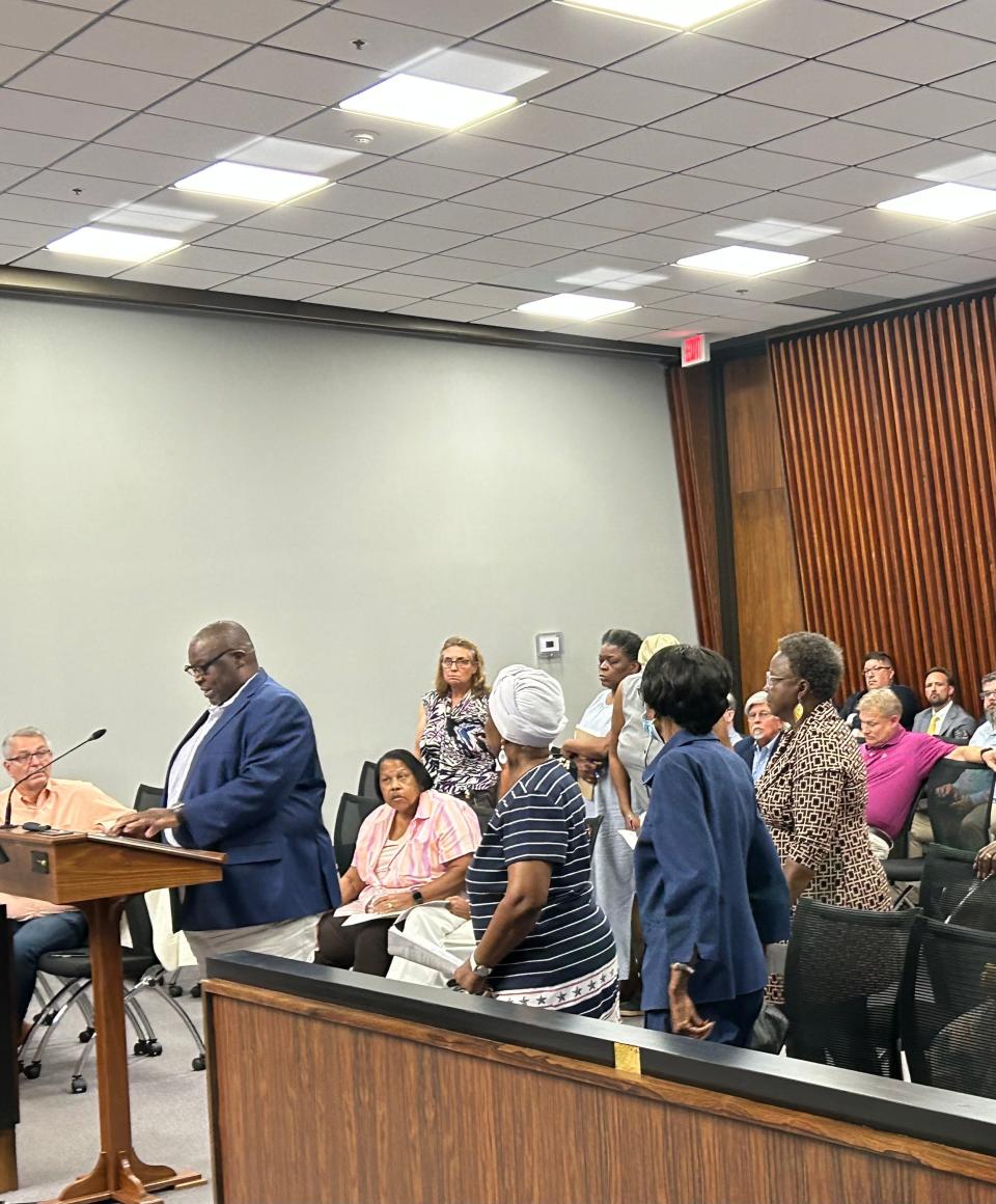 Nicholtown residents stood in solidarity at the planning commission meeting as Nicholtown Neighborhood Association Calvin Hailstock spoke at the meeting.