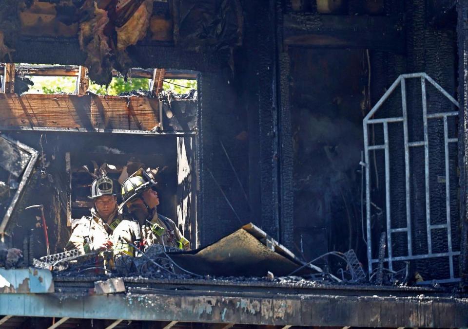 Charlotte Fire personnel investigate the interior of a condominium at 425 West 8th St. in uptown Charlotte, NC on Tuesday, May 2, 2023 following a fire.