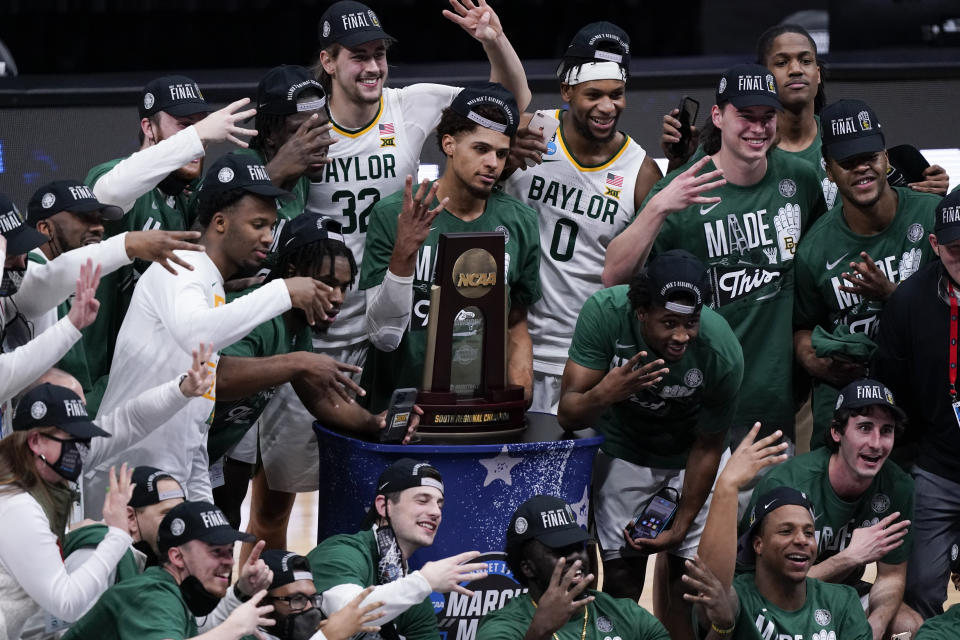 Baylor players celebrate after an Elite 8 game against Arkansas in the NCAA men's college basketball tournament at Lucas Oil Stadium, Tuesday, March 30, 2021, in Indianapolis. Baylor won 81-72. (AP Photo/Michael Conroy)