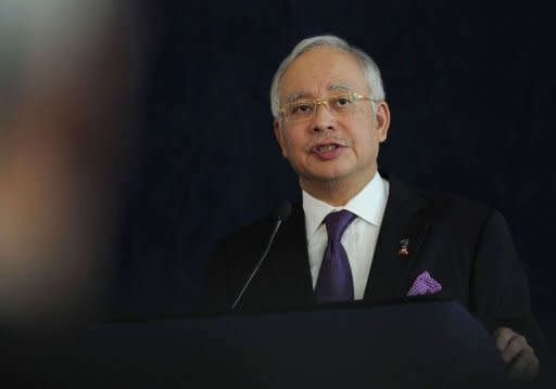Malaysian Prime Minister Najib Razak addresses a forum on July 15. A French lawyer who represents a rights group in an inquiry into alleged corruption linked to Najib was Friday detained in Kuala Lumpur and will be deported, he said