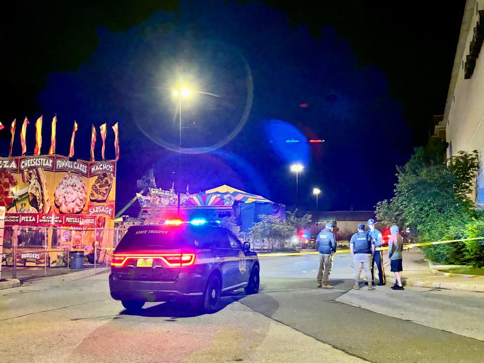 More than an hour after two people were shot at a carnival at the Concord Mall Saturday night, police remained on scene.