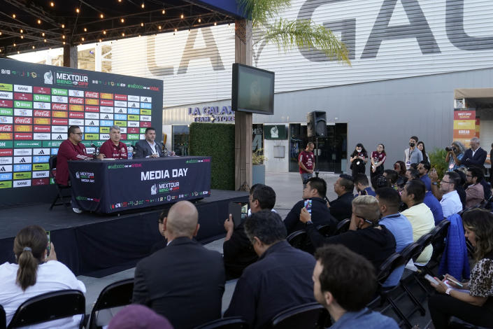 Mexico manager Gerardo Martino, back center, fields questions during the soccer team's Media Day ahead of the 2022 FIFA World Cup in Qatar Tuesday, Sept. 20, 2022, in Carson, Calif. (AP Photo/Marcio Jose Sanchez)
