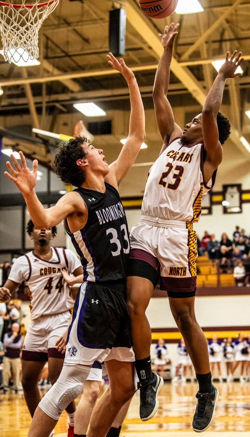 North's Christopher Vaughns Jr. (23) shoots over South's Matt Tierney (33) during the Bloomington North versus Bloomington South boys basketball game at Bloomington High School North on Friday, Jan. 5, 2024. North won the game 56-53.