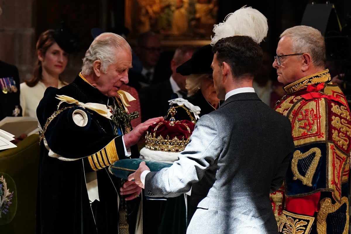 King Charles III is presented with the Crown of Scotland (PA)