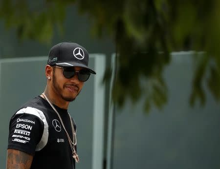 Formula One - F1 - Malaysia Grand Prix - Sepang, Malaysia- 1/10/16 Mercedes' Lewis Hamilton of Britain arrives ahead of the third practice. REUTERS/Edgar Su