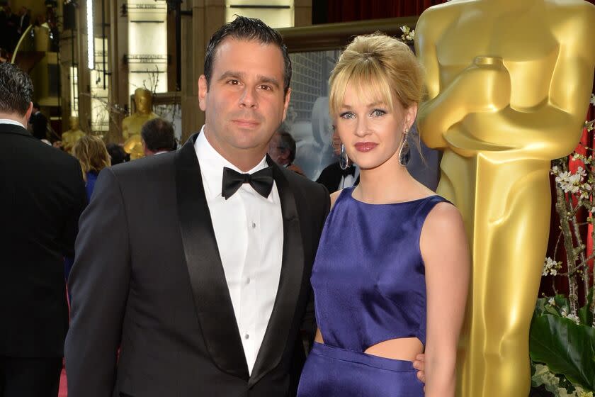 HOLLYWOOD, CA - MARCH 02: Producer Randall Emmett and Amber Childers attend the Oscars held at Hollywood & Highland Center on March 2, 2014 in Hollywood, California. (Photo by George Pimentel/Getty Images)