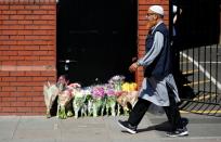 Floral tributes are left outside the Finsbury Park mosque in north London, on June 19, 2017