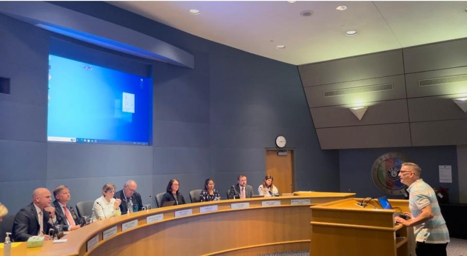 Carlo Toppi addresses the Troy School District board in Troy, Michigan on May 16, 2023, expressing opposition to the removal of honors and honors-track classes in some grades. The board later voted 6-1 to approve the changes.