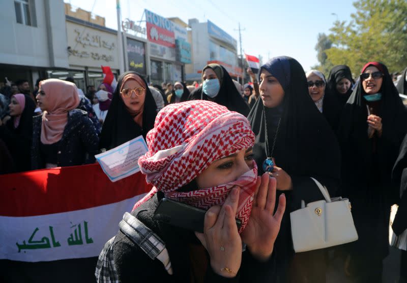 University students shout slogans, during ongoing anti-government protests in Kerbala