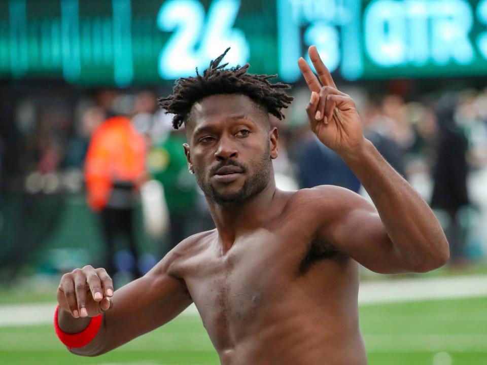 Antonio Brown removed his pads, jersey, gloves and T-shirt - before walking down the sideline and into the end zone (AP)