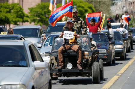 Opposition supporters drive cars while protesting against the ruling elite during a rally in Yerevan, Armenia April 26, 2018. REUTERS/Gleb Garanich