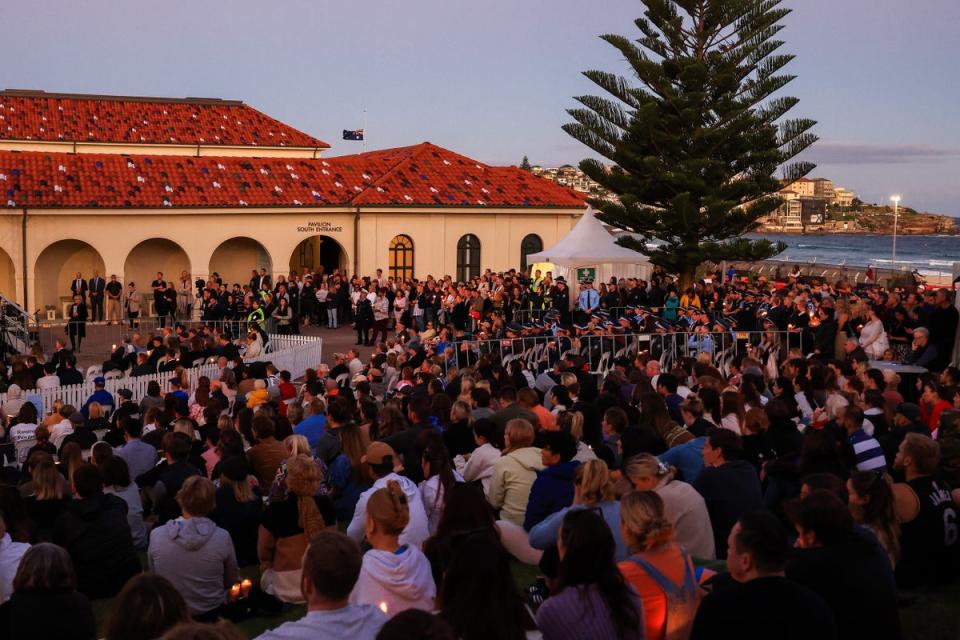 People hold vigil for the victims of Sydney shopping centre attack (Getty Images)