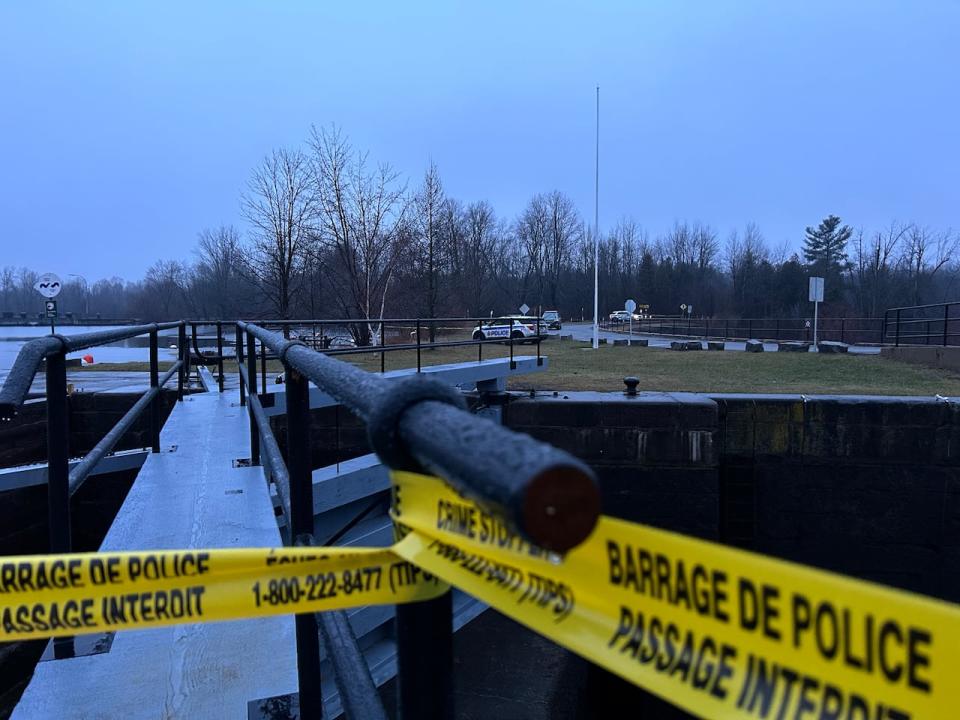 Police tape is strung up on a lock on the Rideau River Thursday morning near where emergency services are searching for a teenager who is still missing after falling through the ice while out with friends on Wednesday, Dec. 27, 2023.